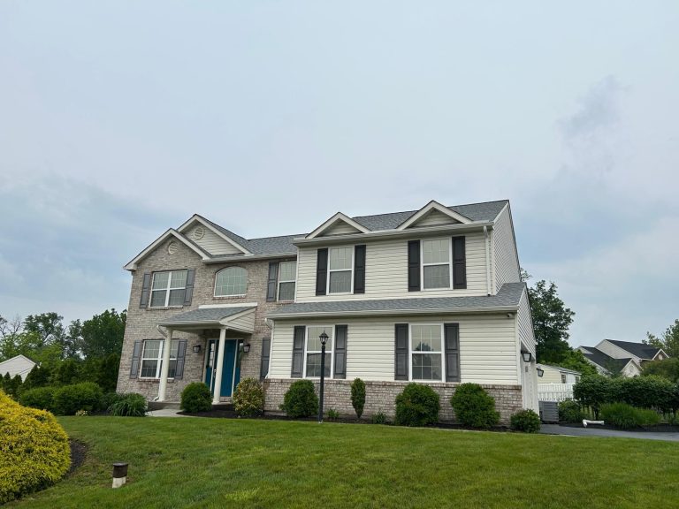 GAF Fox Hollow Gray Roof and Gutter Replacement on a white washed brick house with cream siding in Reading PA